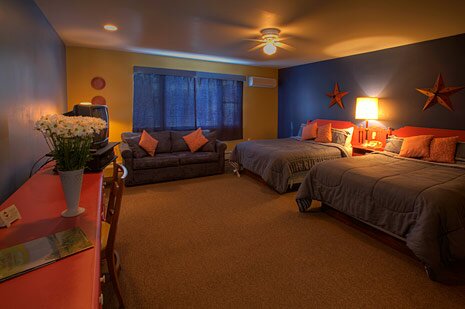 motel room showing beds and living area